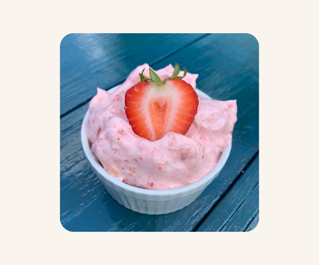 Strawberry ice-cream mousse in a white ramekin
